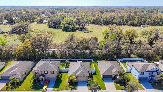 birds eye view of property with a residential view and a view of trees