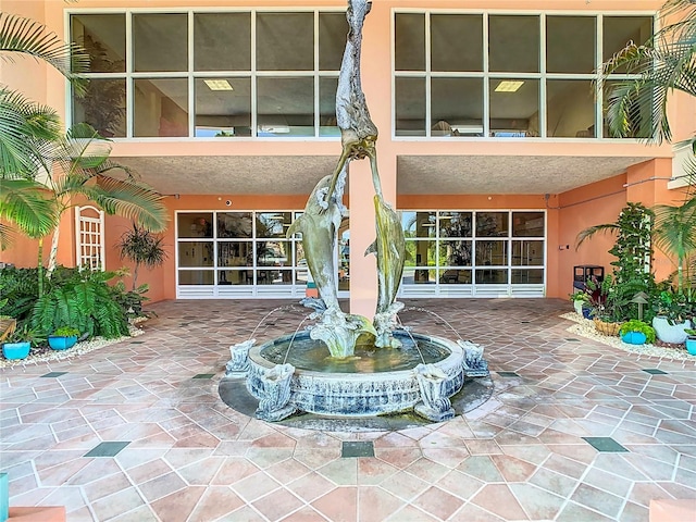 rear view of property featuring a patio area