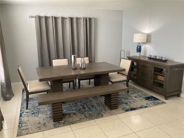 dining area with light tile patterned floors