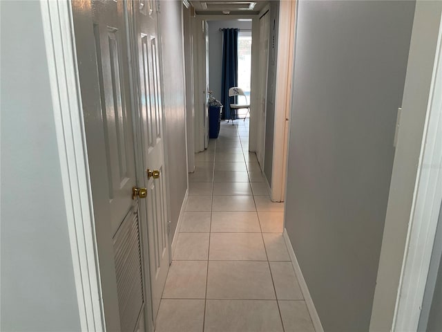 hallway with light tile patterned floors