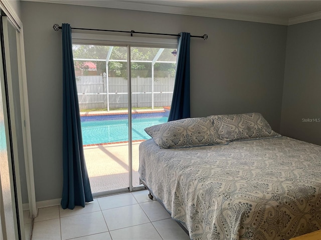 tiled bedroom with a closet, crown molding, and access to exterior