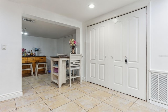 interior space featuring visible vents and light tile patterned floors