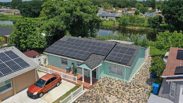 bird's eye view with a residential view and a water view