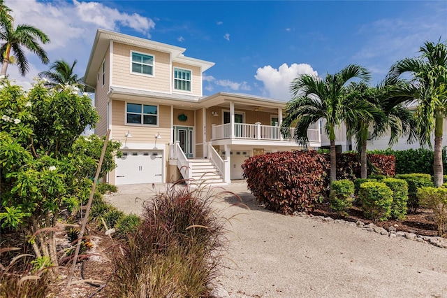 210 Lakeview Dr, Anna Maria, FL 34216 - raised beach house with dirt driveway and a garage