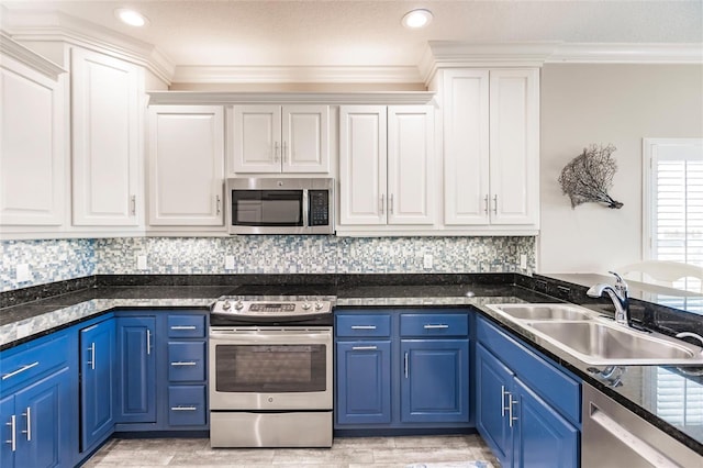 210 Lakeview Dr, Anna Maria, FL 34216 - kitchen featuring white cabinets, a sink, blue cabinets, and appliances with stainless steel finishes