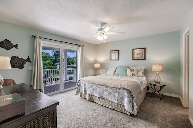 210 Lakeview Dr, Anna Maria, FL 34216 - carpeted bedroom with a textured ceiling, access to exterior, baseboards, and ceiling fan