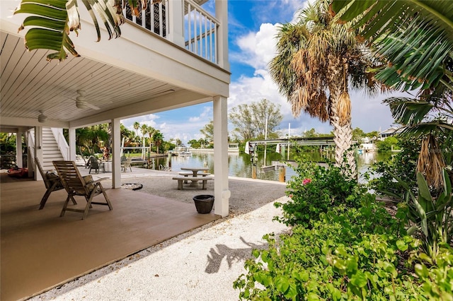 210 Lakeview Dr, Anna Maria, FL 34216 - view of patio / terrace featuring a water view, a boat dock, boat lift, and a ceiling fan
