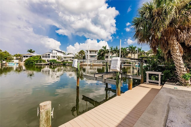 210 Lakeview Dr, Anna Maria, FL 34216 - view of dock featuring boat lift, a residential view, and a water view