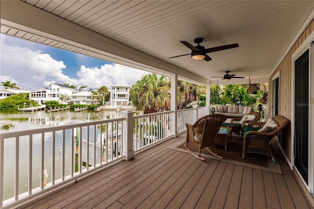210 Lakeview Dr, Anna Maria, FL 34216 - deck featuring an outdoor living space, a water view, ceiling fan, and a residential view