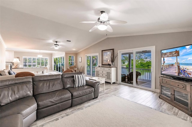 210 Lakeview Dr, Anna Maria, FL 34216 - living room featuring crown molding, lofted ceiling, wood finished floors, and ceiling fan with notable chandelier