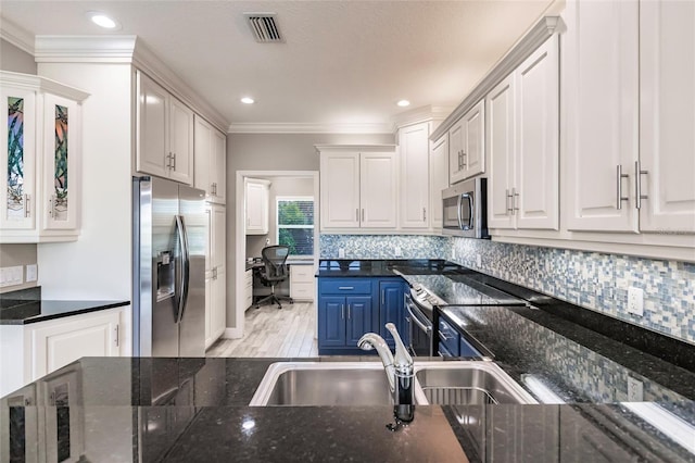 210 Lakeview Dr, Anna Maria, FL 34216 - kitchen featuring a sink, blue cabinets, appliances with stainless steel finishes, visible vents, and white cabinets