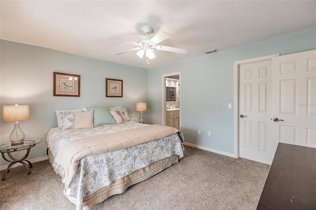 210 Lakeview Dr, Anna Maria, FL 34216 - bedroom with visible vents, carpet, baseboards, connected bathroom, and a ceiling fan
