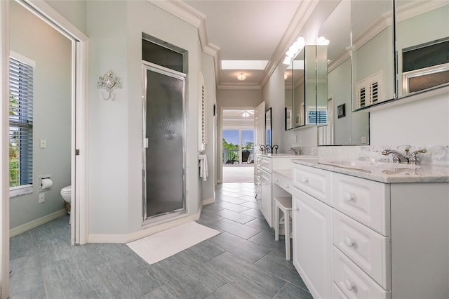 210 Lakeview Dr, Anna Maria, FL 34216 - bathroom with double vanity, crown molding, toilet, and a shower stall