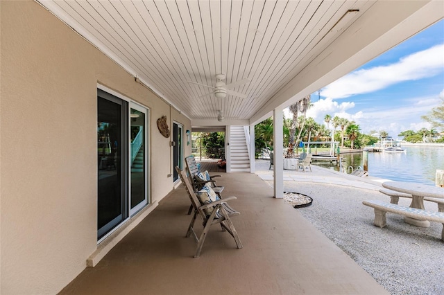 210 Lakeview Dr, Anna Maria, FL 34216 - view of patio featuring a water view and ceiling fan