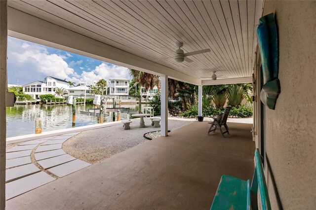 210 Lakeview Dr, Anna Maria, FL 34216 - view of patio / terrace featuring a ceiling fan, a residential view, boat lift, a water view, and a boat dock