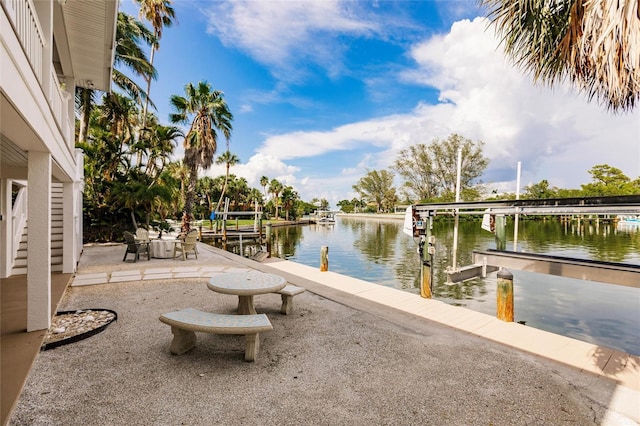210 Lakeview Dr, Anna Maria, FL 34216 - view of dock with a water view and a patio area