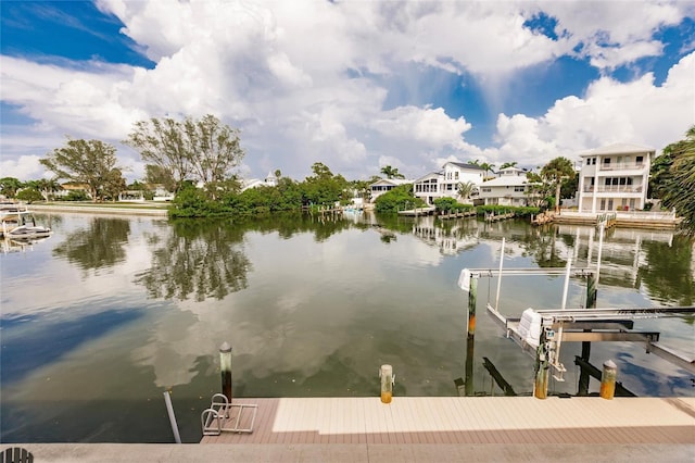 210 Lakeview Dr, Anna Maria, FL 34216 - view of dock featuring boat lift and a water view