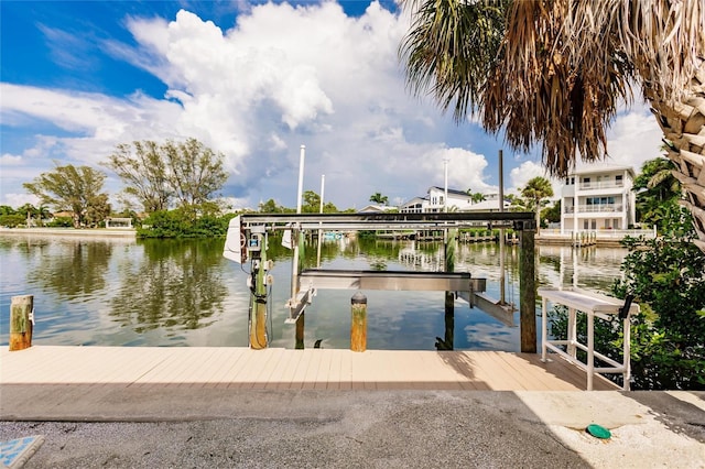 210 Lakeview Dr, Anna Maria, FL 34216 - view of dock featuring boat lift and a water view