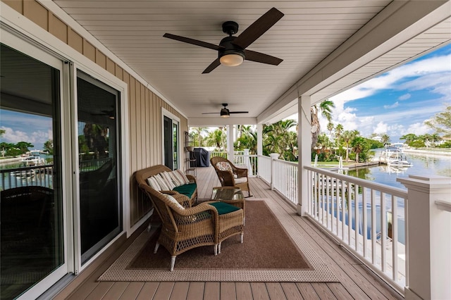 210 Lakeview Dr, Anna Maria, FL 34216 - wooden deck with a water view and ceiling fan