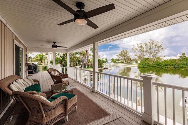 210 Lakeview Dr, Anna Maria, FL 34216 - wooden deck with a ceiling fan and a water view