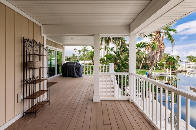 210 Lakeview Dr, Anna Maria, FL 34216 - wooden terrace with a water view and area for grilling