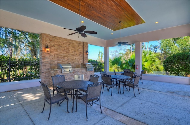 view of patio / terrace with area for grilling, ceiling fan, and grilling area