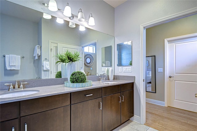 bathroom featuring hardwood / wood-style flooring and vanity