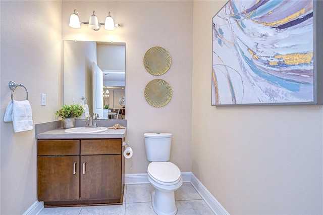 bathroom with tile patterned floors, vanity, and toilet