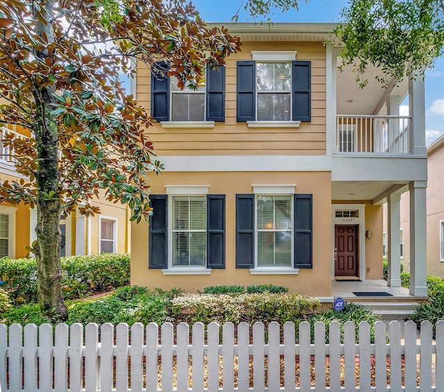 view of front of house with a balcony