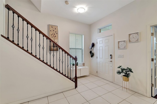 entrance foyer with light tile patterned floors