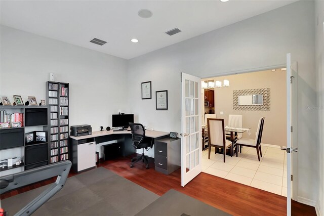 home office with french doors and wood-type flooring