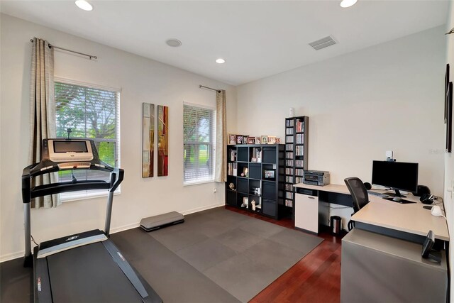 office space with dark wood-type flooring