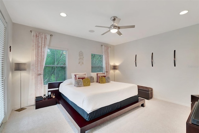 carpeted bedroom featuring ceiling fan