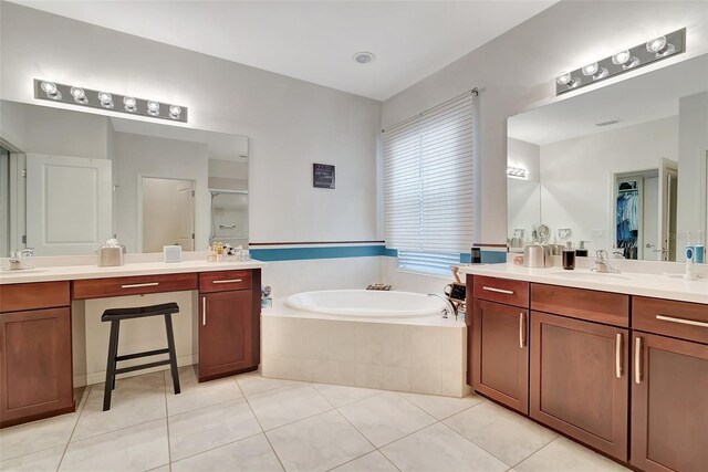 bathroom with vanity, shower with separate bathtub, and tile patterned flooring