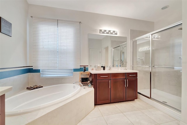 bathroom featuring vanity, plus walk in shower, and tile patterned floors