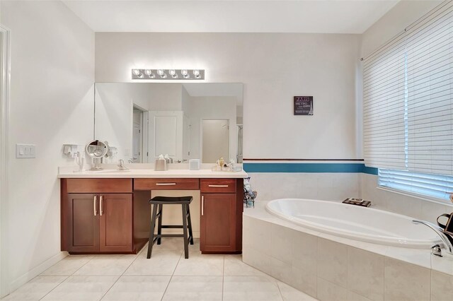 bathroom featuring vanity, plus walk in shower, and tile patterned flooring