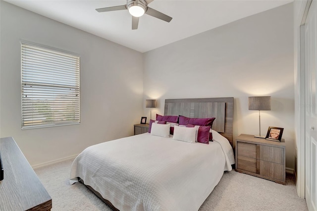 bedroom featuring ceiling fan and light colored carpet