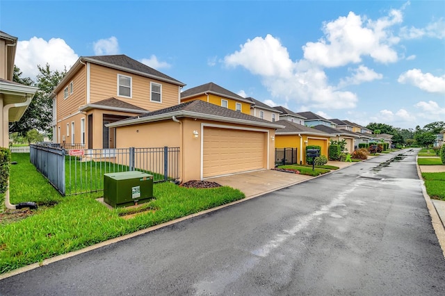 view of front of property with a front yard and a garage