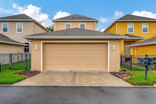 view of front property with a front yard and a garage