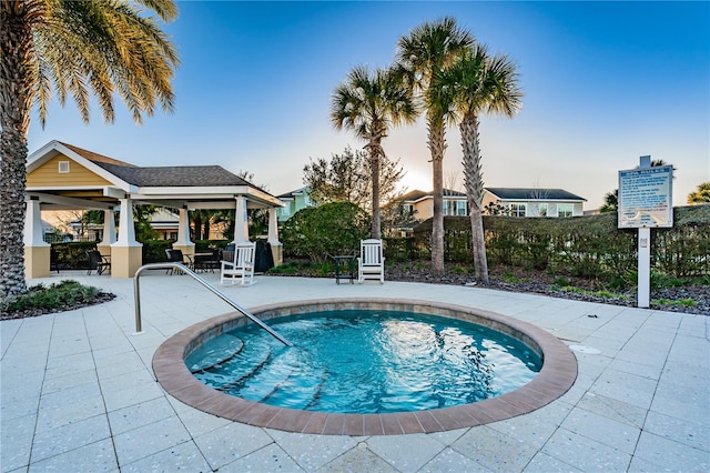 view of swimming pool with a gazebo and a patio area