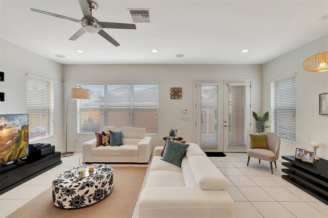 living room featuring ceiling fan, recessed lighting, visible vents, and light tile patterned floors
