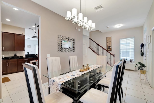 11329 Emerson Lake Dr, Riverview, FL 33578 - dining space featuring light tile patterned floors, stairway, and recessed lighting