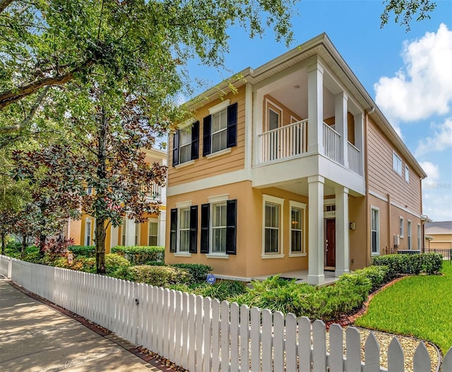 11329 Emerson Lake Dr, Riverview, FL 33578 - view of home's exterior with a balcony and stucco siding