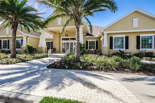 11329 Emerson Lake Dr, Riverview, FL 33578 - view of front of property featuring stucco siding and french doors