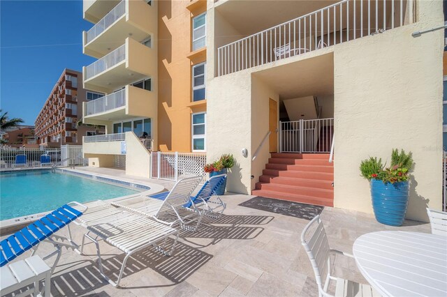 view of swimming pool with a patio area