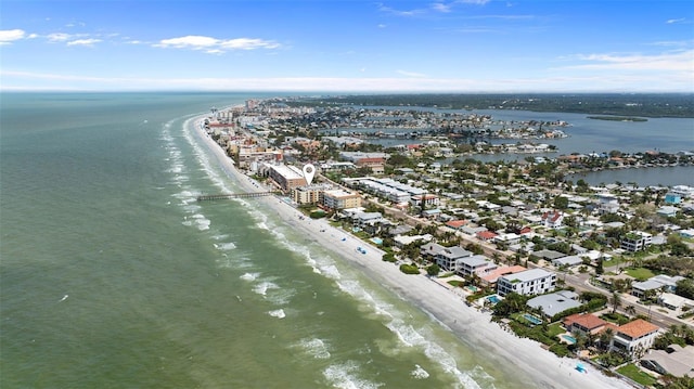 drone / aerial view with a water view and a beach view