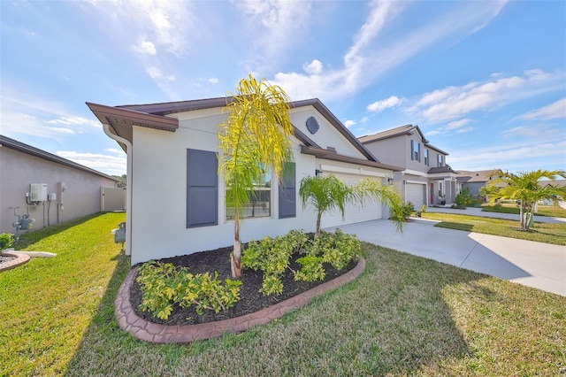 view of side of home with a yard and a garage