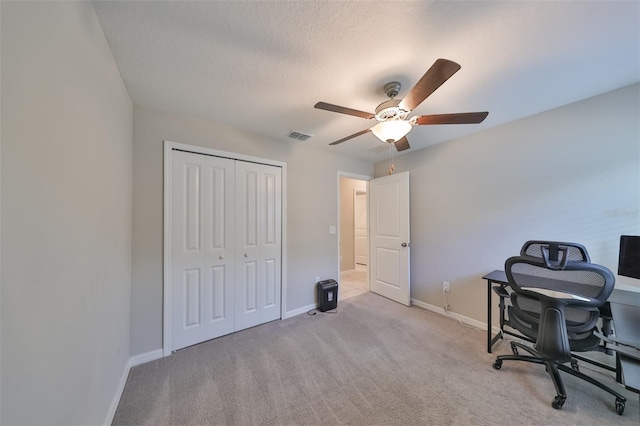 office with ceiling fan and light colored carpet