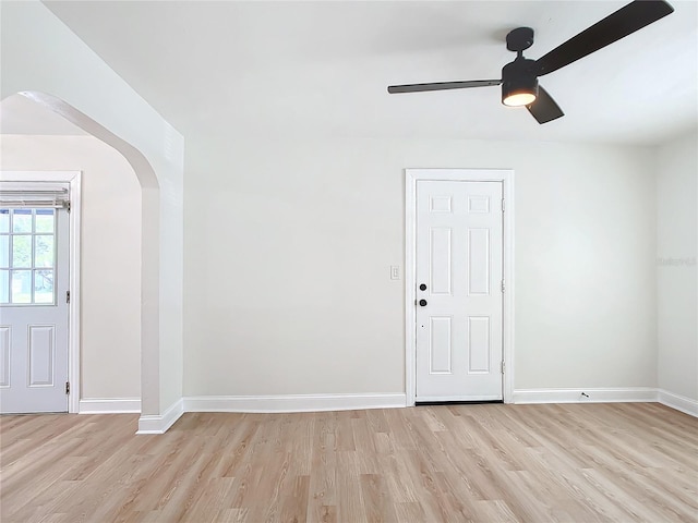 foyer with light hardwood / wood-style floors and ceiling fan