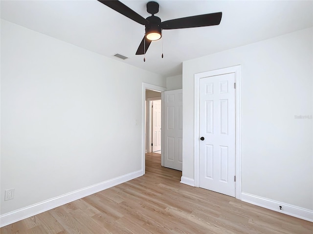 unfurnished bedroom featuring ceiling fan and light wood-type flooring